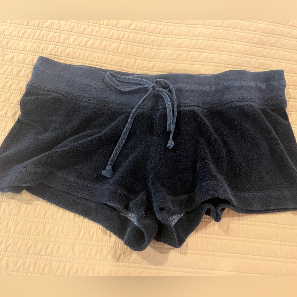 Hard tail low rise black terry cloth shorts.
